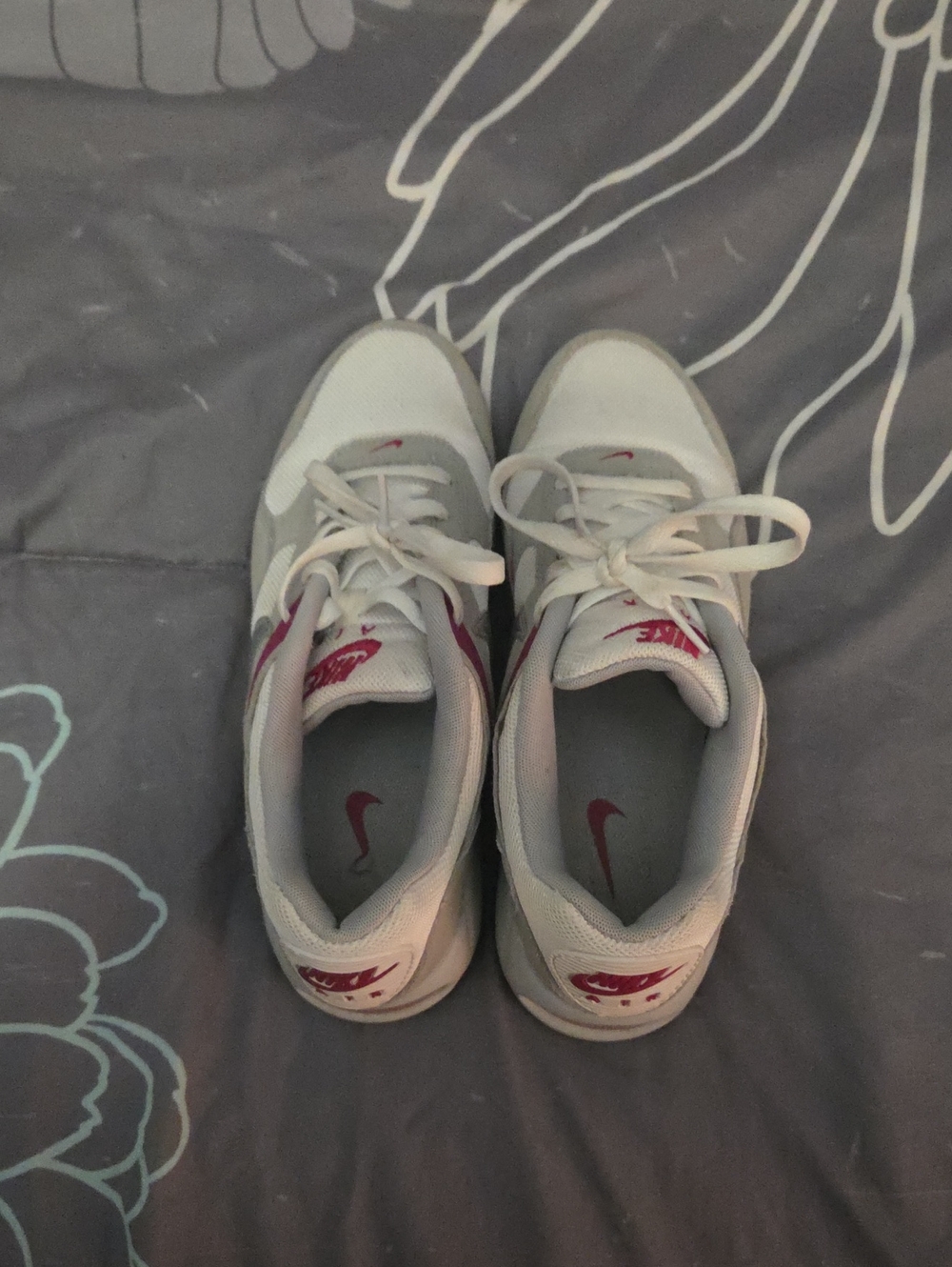 Nike Women’s Air  White Sneakers with Pink Swoosh Accents